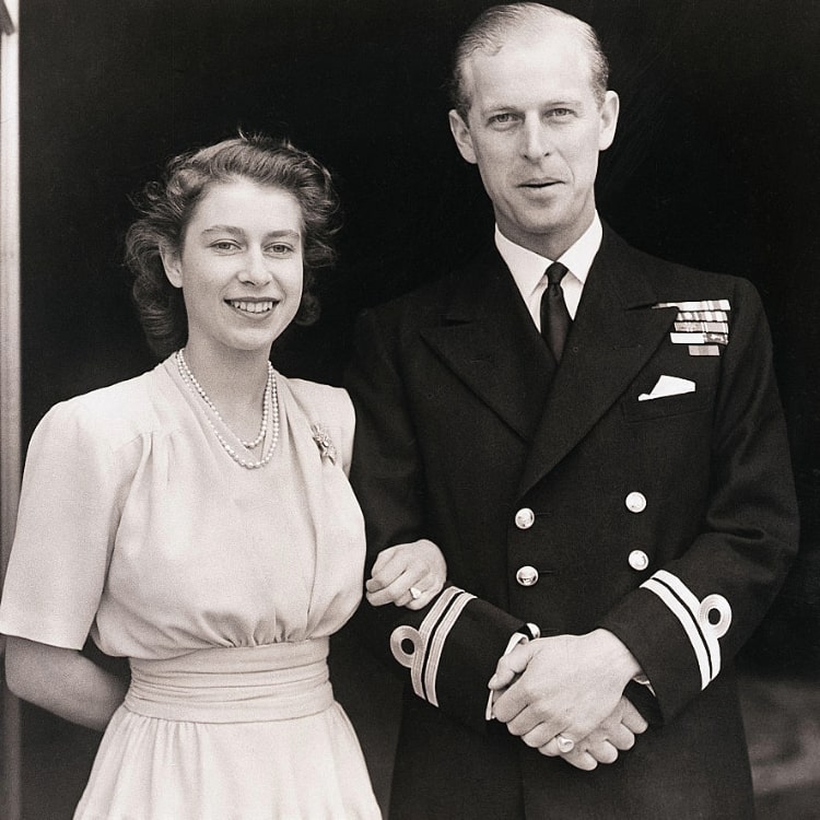 Queen Elizabeth II and Prince Philip showing engagement ring