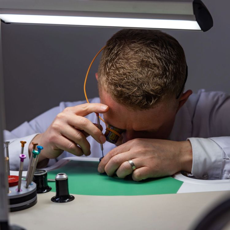 Watch technician servicing a watch