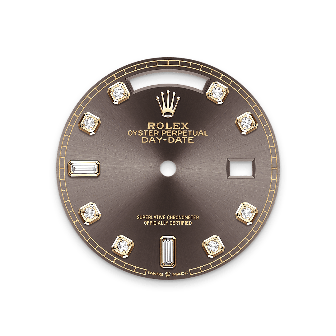 This dial features diamonds in 18 ct gold settings and baguette-cut diamonds at 6 and 9 o'clock. The sunray finish creates delicate light reflections on many dials in the Oyster Perpetual collection. It is obtained using masterful brushing techniques that create grooves running outwards from the centre of the dial. Light is diffused consistently along each engraving, creating a characteristic subtle glow that moves depending on the position of the wrist. Once the sunray finish has been completed, the dial colour is applied using Physical Vapour Deposition or electroplating. A light coat of var