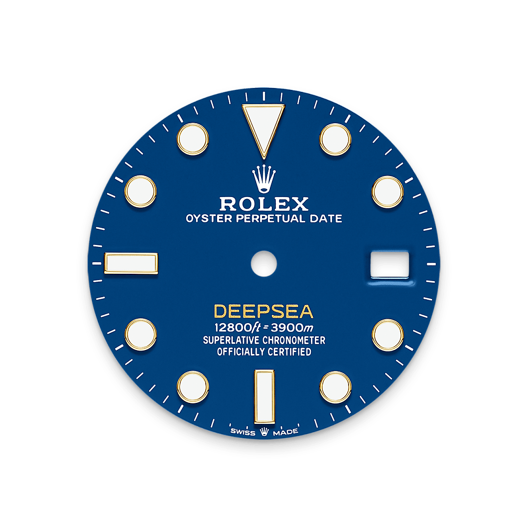 The blue lacquer dial bearing the name ‘DEEPSEA’ in powdered yellow. The dial features large Chromalight hour markers and hands, filled with luminescent material that emits a long-lasting blue glow for excellent legibility in dark conditions.

The simple forms of the hour markers – triangles, circles and rectangles – and the hands, which are clearly differentiated in size and shape, are filled or coated with a luminescent material emitting a long-lasting blue glow – for up to two times longer than traditional phosphorescent materials.
