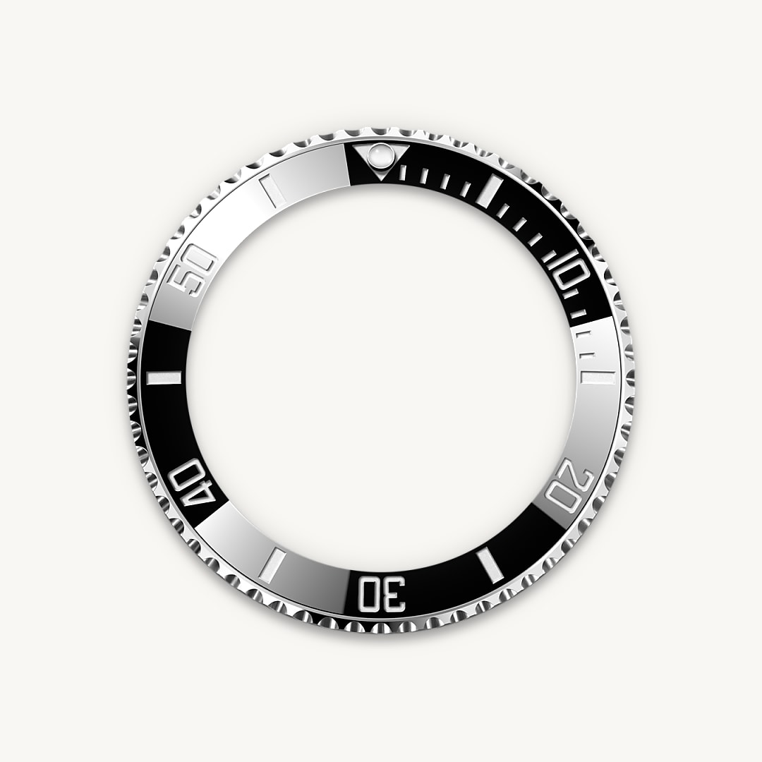 The Submariner's rotatable bezel is a key functionality of the watch. Its 60-minute graduations allow a diver to accurately and safely monitor diving time and decompression stops. Manufactured by Rolex from a hard, corrosion-resistant ceramic, the Cerachrom bezel insert is virtually scratchproof. A luminescent capsule on the zero marker ensures legibility, no matter how dark the environment. The bezel’s knurled edge is carefully designed to offer excellent grip under water, even with gloves.