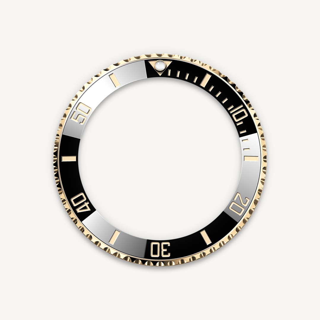 The Submariner's rotatable bezel is a key functionality of the watch. Its 60-minute graduations allow a diver to accurately and safely monitor diving time and decompression stops. Manufactured by Rolex from a hard, corrosion-resistant ceramic, the Cerachrom bezel insert is virtually scratchproof. A luminescent capsule on the zero marker ensures legibility, no matter how dark the environment. The bezel’s knurled edge is carefully designed to offer excellent grip under water, even with gloves.