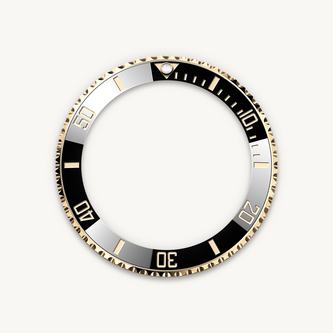 The Submariner's rotatable bezel is a key functionality of the watch. Its 60-minute graduations allow a diver to accurately and safely monitor diving time and decompression stops. Manufactured by Rolex from a hard, corrosion-resistant ceramic, the Cerachrom bezel insert is virtually scratchproof. A luminescent capsule on the zero marker ensures legibility, no matter how dark the environment. The bezel’s knurled edge is carefully designed to offer excellent grip under water, even with gloves.