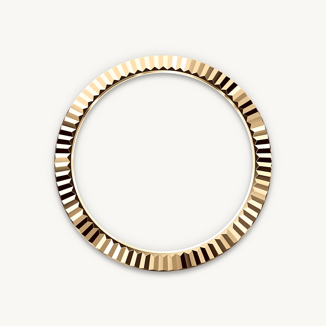 The Rolex fluted bezel is a mark of distinction. Originally, the fluting of the Oyster bezel had a functional purpose: it served to screw the bezel onto the case, helping to ensure the waterproofness of the watch. It was therefore identical to the fluting on the case back, which was also screwed onto the case for waterproofness, using specific Rolex tools. Over time, the fluting became an aesthetic element, a genuine Rolex signature feature. Today the fluted bezel is a mark of distinction, always in gold. The Sky-Dweller is equipped with a mechanism of interaction between the rotatable bezel, the winding crown and the movement: the Ring Command system, which allows the user to select the watch's functions one-by-one and to set them easily, quickly and securely.