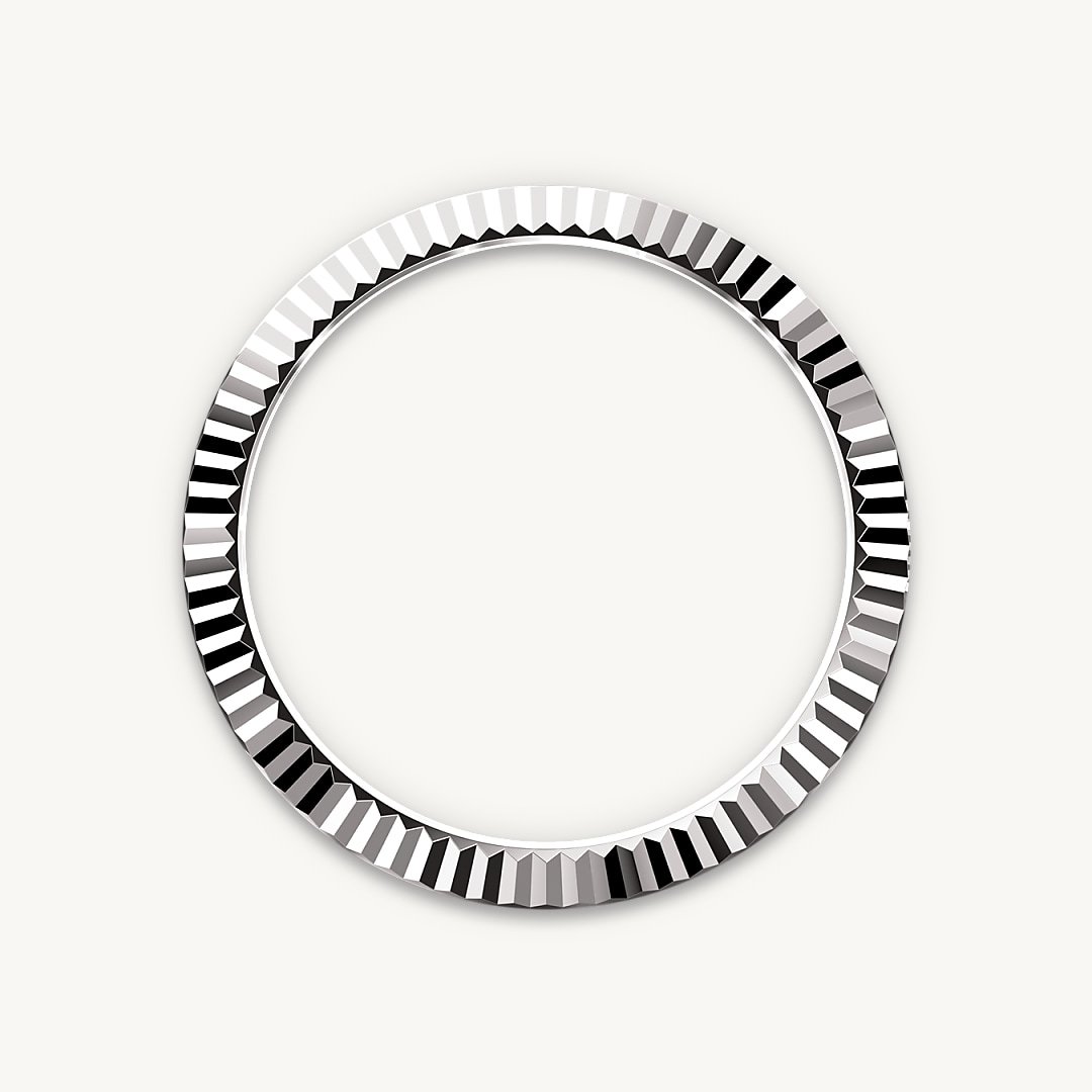 The Rolex fluted bezel is a mark of distinction. Originally, the fluting of the Oyster bezel had a functional purpose: it served to screw the bezel onto the case, helping to ensure the waterproofness of the watch. It was therefore identical to the fluting on the case back, which was also screwed onto the case for waterproofness, using specific Rolex tools. Over time, the fluting became an aesthetic element, a genuine Rolex signature feature. Today the fluted bezel is a mark of distinction, always in gold. The Sky-Dweller is equipped with a mechanism of interaction between the rotatable bezel, the winding crown and the movement: the Ring Command system, which allows the user to select the watch's functions one-by-one and to set them easily, quickly and securely.