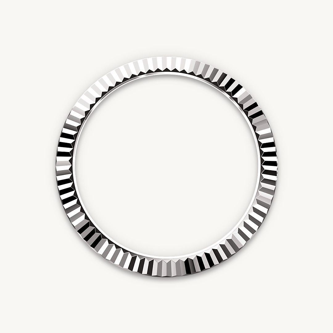 The Rolex fluted bezel is a mark of distinction. Originally, the fluting of the Oyster bezel had a functional purpose: it served to screw the bezel onto the case, helping to ensure the waterproofness of the watch. It was therefore identical to the fluting on the case back, which was also screwed onto the case for waterproofness, using specific Rolex tools. Over time, the fluting became an aesthetic element, a genuine Rolex signature feature. Today the fluted bezel is a mark of distinction, always in gold. The Sky-Dweller is equipped with a mechanism of interaction between the rotatable bezel, the winding crown and the movement: the Ring Command system, which allows the user to select the watch's functions one-by-one and to set them easily, quickly and securely.
