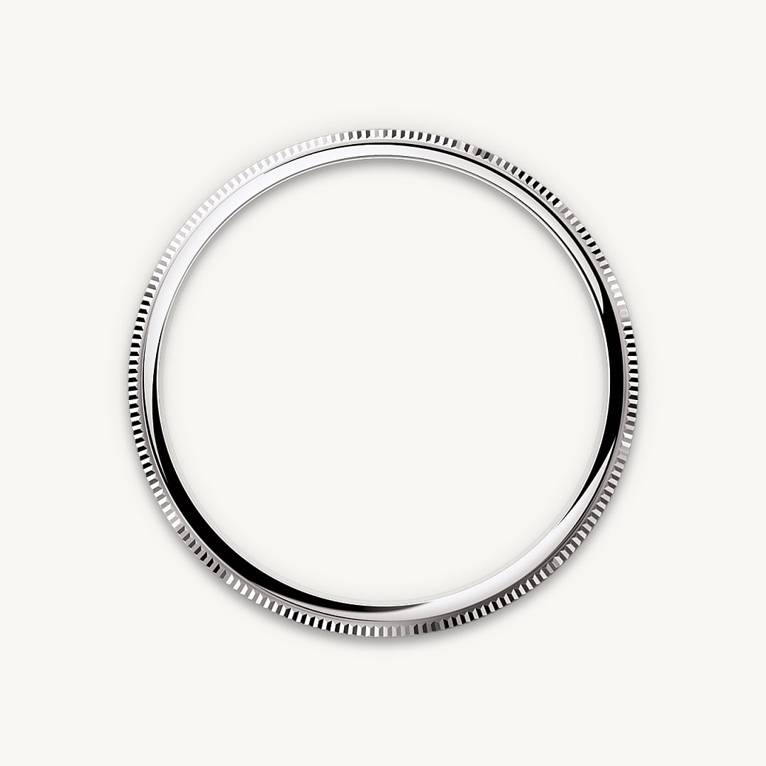 This elegant and understated watch features a slim case crowned with a bezel that is part domed and part finely fluted – the lower part being given an elegant fluting and the upper part domed.