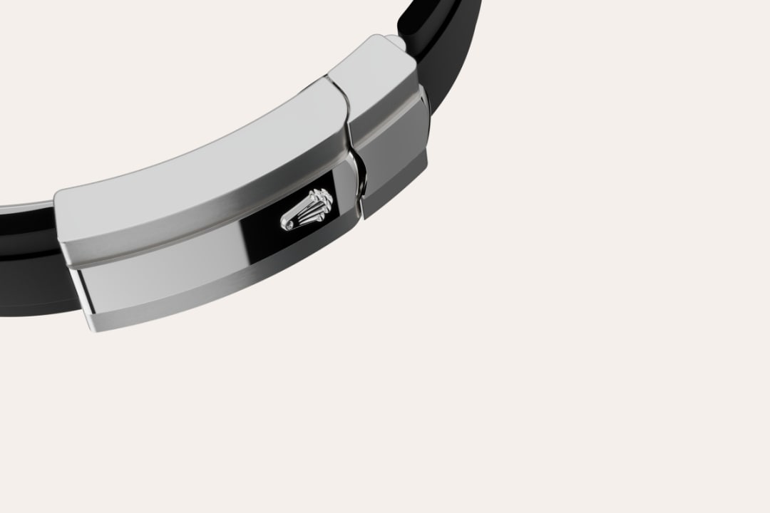 The Sky-Dweller’s new Oysterflex bracelet, developed by Rolex and patented, offers a sporty alternative to metal bracelets. The bracelet attaches to the watch case and the Oysterclasp by a flexible titanium and nickel alloy metal blade. The blade is overmoulded with high-performance black elastomer which is particularly resistant to environmental effects, very durable and perfectly inert for the wearer of the watch. For enhanced comfort, the inside of the Oysterflex bracelet is equipped with a patented longitudinal cushion system that stabilizes the watch on the wrist and fitted with an 18 ct white gold Oysterclasp. It also features the Rolex Glidelock extension system, designed by the brand and patented. This inventive toothed mechanism, integrated beneath the clasp, allows fine adjustment of the bracelet length by some 15 mm in increments of approximately 2.5 mm, without the use of tools.