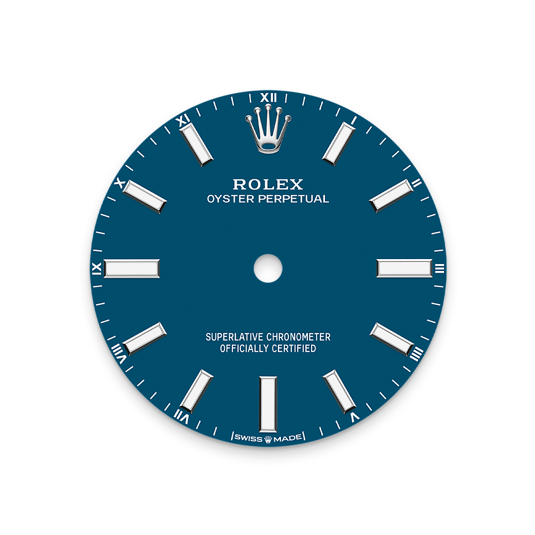 The colours created for the Oyster Perpetual range start life as a lacquer, which must be meticulously applied in a controlled-atmosphere environment to avoid dust and other contamination. The brass plate of the dial base receives layer upon layer of lacquer, six in all, to form a regular, uniform surface. The last step is varnishing and polishing to bring out the full brilliance and depth of colour. The various inscriptions are then pad printed, and the hour markers and crown riveted by hand. The dial, gleaming in its perfection, is all set to take its place on top of the movement at the watch assembly phase.
