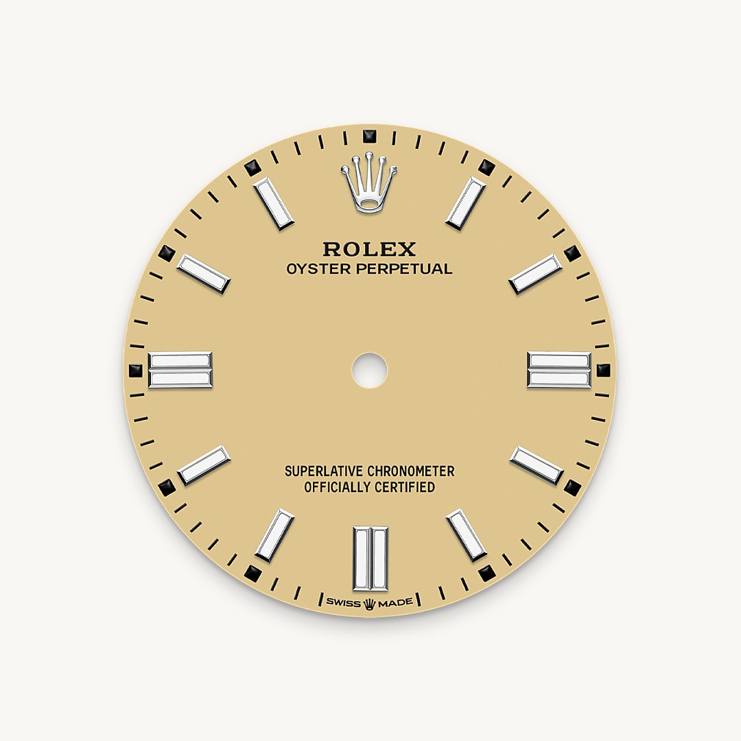 The colours created for the Oyster Perpetual range start life as a lacquer, which must be meticulously applied in a controlled-atmosphere environment to avoid dust and other contamination. The brass plate of the dial base receives layer upon layer of lacquer, six in all, to form a regular, uniform surface. The last step is varnishing and polishing to bring out the full brilliance and depth of colour. The various inscriptions are then pad printed, and the hour markers and crown riveted by hand. The dial, gleaming in its perfection, is all set to take its place on top of the movement at the watch assembly phase.
