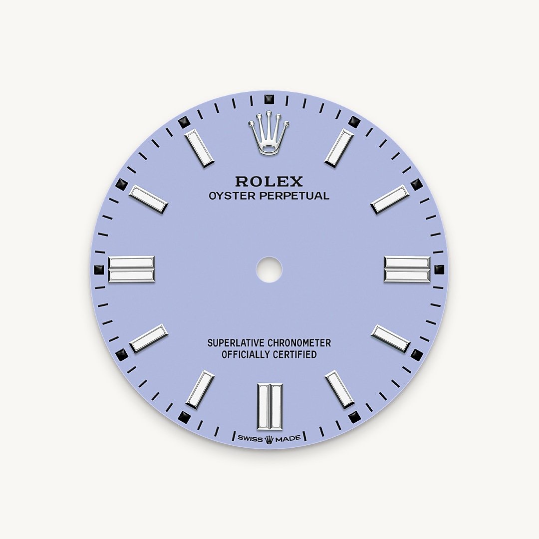 The colours created for the Oyster Perpetual range start life as a lacquer, which must be meticulously applied in a controlled-atmosphere environment to avoid dust and other contamination. The brass plate of the dial base receives layer upon layer of lacquer, six in all, to form a regular, uniform surface. The last step is varnishing and polishing to bring out the full brilliance and depth of colour. The various inscriptions are then pad printed, and the hour markers and crown riveted by hand. The dial, gleaming in its perfection, is all set to take its place on top of the movement at the watch assembly phase.