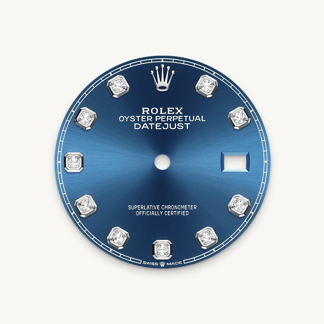 This dial features diamonds in 18 ct gold settings. The sunray finish creates delicate light reflections on many dials in the Oyster Perpetual collection. It is obtained using masterful brushing techniques that create grooves running outwards from the centre of the dial. Light is diffused consistently along each engraving, creating a characteristic subtle glow that moves depending on the position of the wrist. Once the sunray finish has been completed, the dial colour is applied using Physical Vapour Deposition or electroplating. A light coat of varnish gives the dial its final look.