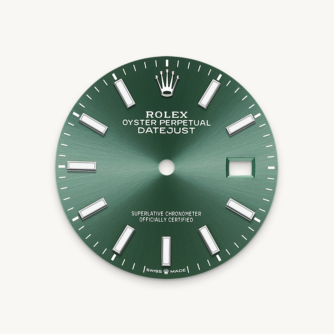 The sunray finish creates delicate light reflections on many dials in the Oyster Perpetual collection. It is obtained using masterful brushing techniques that create grooves running outwards from the centre of the dial. Light is diffused consistently along each engraving, creating a characteristic subtle glow that moves depending on the position of the wrist. Once the sunray finish has been completed, the dial colour is applied using Physical Vapour Deposition or electroplating. A light coat of varnish gives the dial its final look.