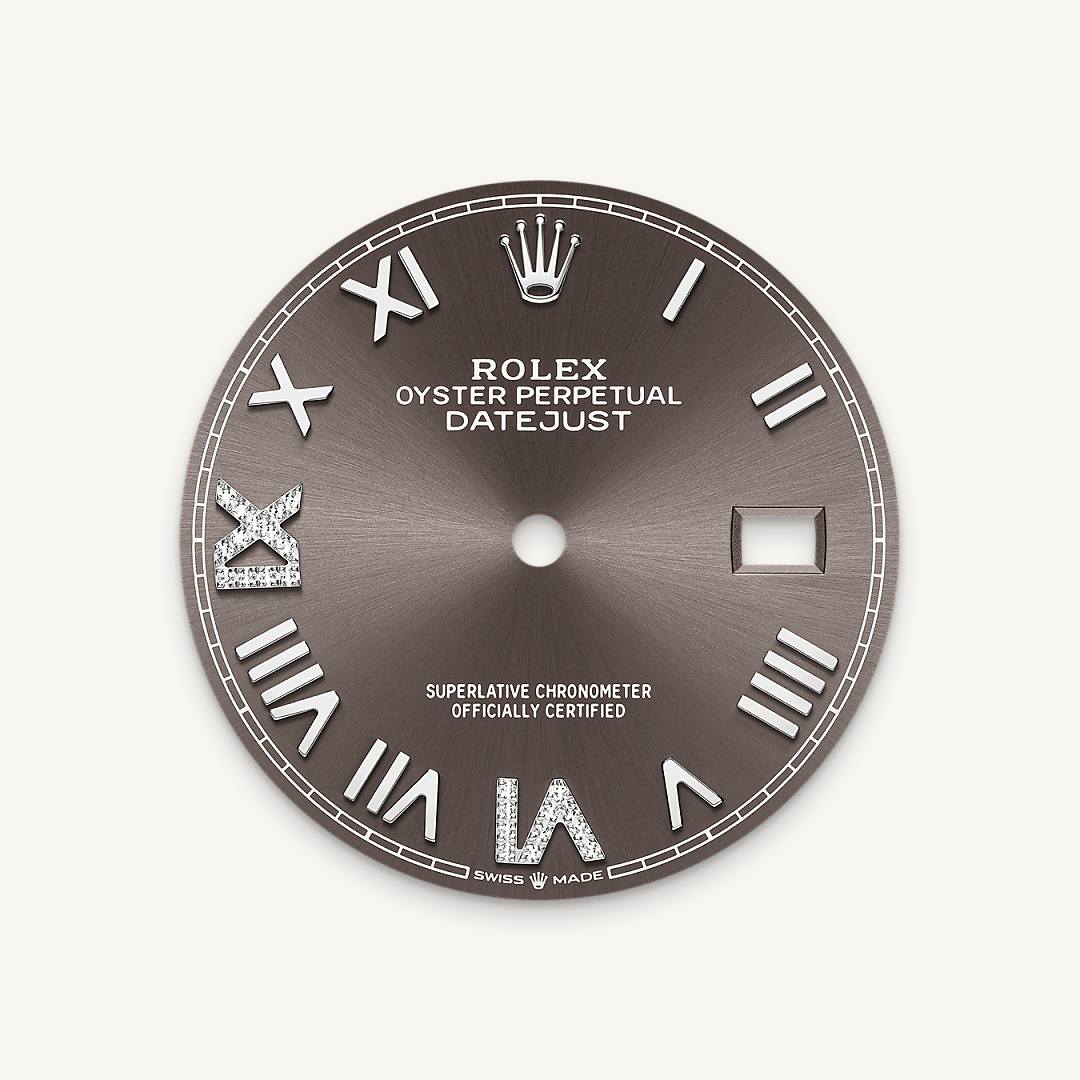 This dial features a Roman VI and IX in 18 ct gold, set with 24 diamonds. The sunray finish creates delicate light reflections on many dials in the Oyster Perpetual collection. It is obtained using masterful brushing techniques that create grooves running outwards from the centre of the dial. Light is diffused consistently along each engraving, creating a characteristic subtle glow that moves depending on the position of the wrist. Once the sunray finish has been completed, the dial colour is applied using Physical Vapour Deposition or electroplating. A light coat of varnish gives the dial its final look.