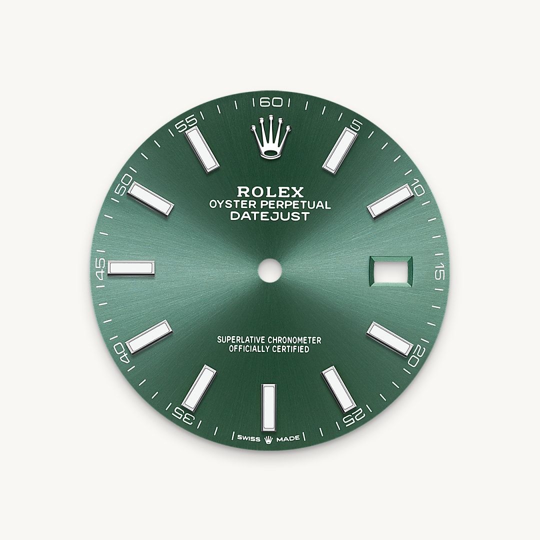 The sunray finish creates delicate light reflections on many dials in the Oyster Perpetual collection. It is obtained using masterful brushing techniques that create grooves running outwards from the centre of the dial. Light is diffused consistently along each engraving, creating a characteristic subtle glow that moves depending on the position of the wrist. Once the sunray finish has been completed, the dial colour is applied using Physical Vapour Deposition or electroplating. A light coat of varnish gives the dial its final look.