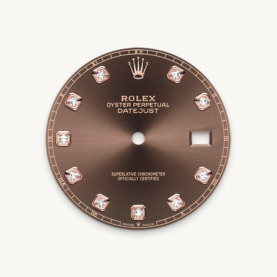 This dial features diamonds in 18 ct gold settings. The sunray finish creates delicate light reflections on many dials in the Oyster Perpetual collection. It is obtained using masterful brushing techniques that create grooves running outwards from the centre of the dial. Light is diffused consistently along each engraving, creating a characteristic subtle glow that moves depending on the position of the wrist. Once the sunray finish has been completed, the dial colour is applied using Physical Vapour Deposition or electroplating. A light coat of varnish gives the dial its final look.