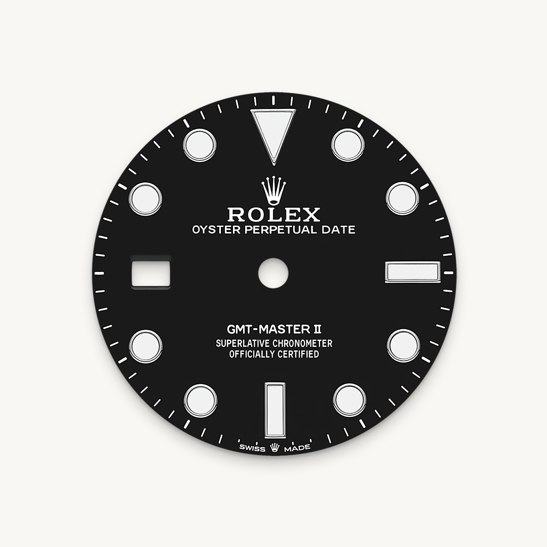 Like all Rolex Professional watches, the GMT-Master II offers exceptional legibility in all circumstances, and especially in the dark, thanks to its Chromalight display. The broad hands and hour markers in simple shapes – triangles, circles, rectangles – are filled with a luminescent material emitting a long-lasting glow.
On this novel version of the watch, the crown and crown guard are on the left side of the watch case. The date aperture and the Cyclops lens are at 9 o’clock.