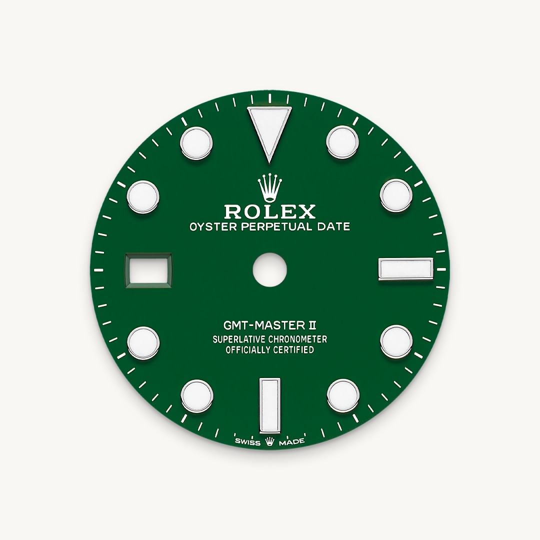 The Cerachrom dial – created in the same way as dials in natural stone, by fitting a disc of material onto a brass plate – displays the same shade of green as the lower half of the two-colour green and black Cerachrom bezel insert that frames the watch face. It is the first Cerachrom dial on a Rolex watch. On this watch, the crown and crown guard are on the left side of the watch case. The date aperture and the Cyclops lens are at 9 o’clock.