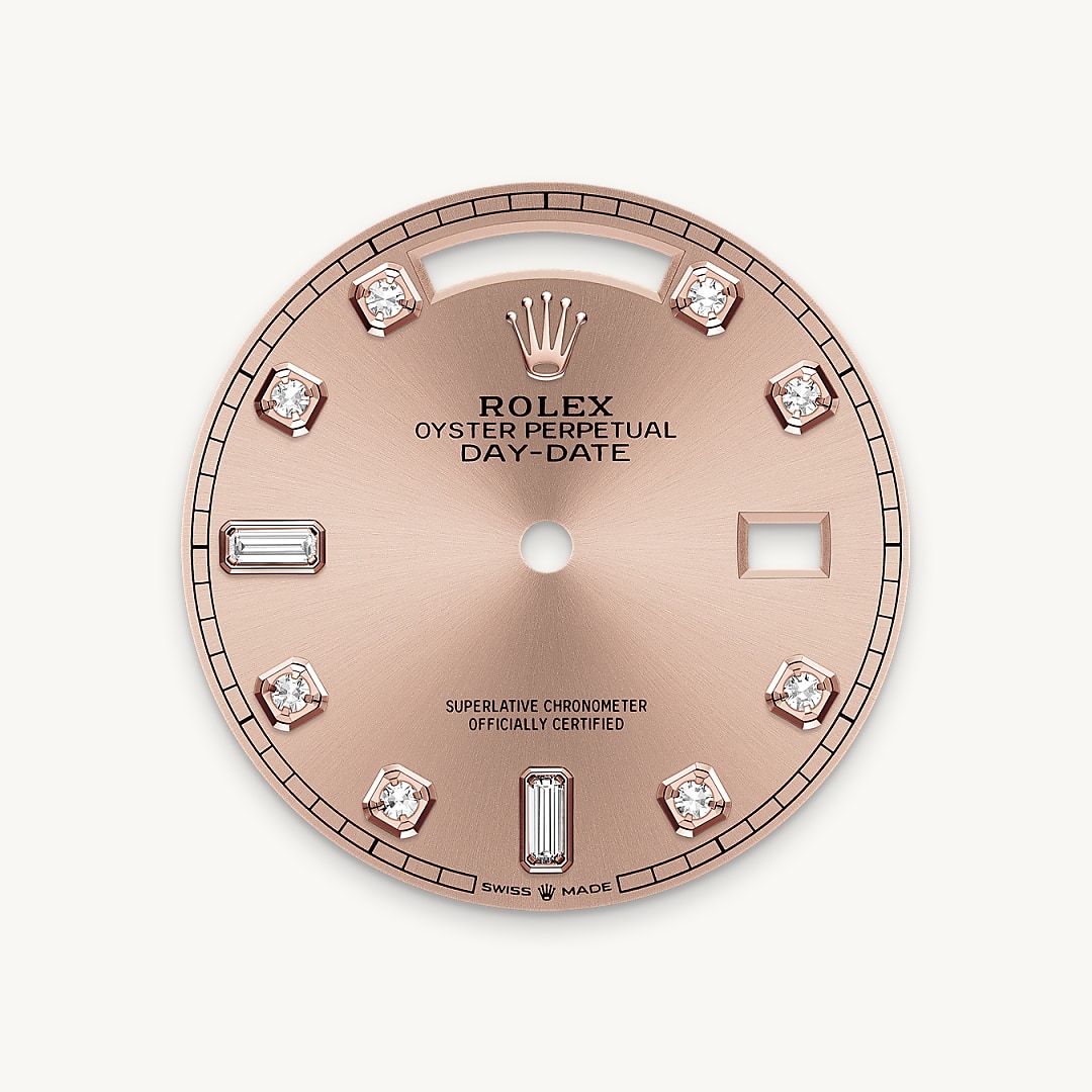This dial features diamonds in 18 ct gold settings and baguette-cut diamonds at 6 and 9 o'clock. The sunray finish creates delicate light reflections on many dials in the Oyster Perpetual collection. It is obtained using masterful brushing techniques that create grooves running outwards from the centre of the dial. Light is diffused consistently along each engraving, creating a characteristic subtle glow that moves depending on the position of the wrist. Once the sunray finish has been completed, the dial colour is applied using Physical Vapour Deposition or electroplating. A light coat of varnish gives the dial its final look.