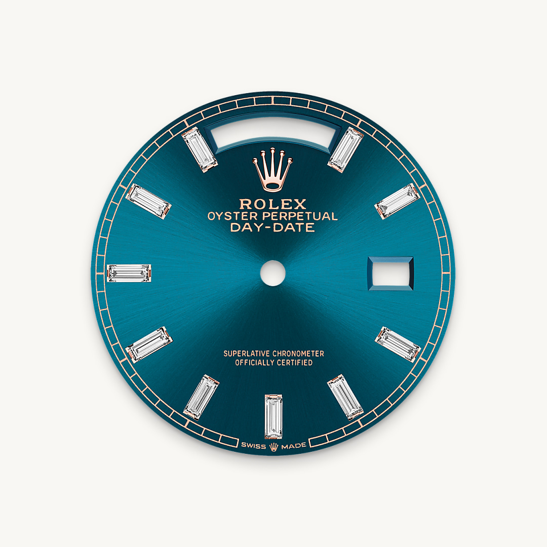 This dial features 10 baguette-cut diamonds. The sunray finish creates delicate light reflections on many dials in the Oyster Perpetual collection. It is obtained using masterful brushing techniques that create grooves running outwards from the centre of the dial. Light is diffused consistently along each engraving, creating a characteristic subtle glow that moves depending on the position of the wrist. Once the sunray finish has been completed, the dial colour is applied using Physical Vapour Deposition or electroplating. A light coat of varnish gives the dial its final look.