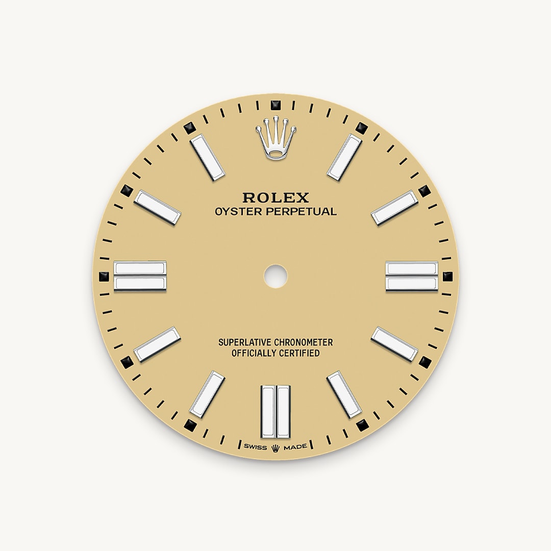 The colours created for the Oyster Perpetual range start life as a lacquer, which must be meticulously applied in a controlled-atmosphere environment to avoid dust and other contamination. The brass plate of the dial base receives layer upon layer of lacquer, six in all, to form a regular, uniform surface. The last step is varnishing and polishing to bring out the full brilliance and depth of colour. The various inscriptions are then pad printed, and the hour markers and crown riveted by hand. The dial, gleaming in its perfection, is all set to take its place on top of the movement at the watch assembly phase.