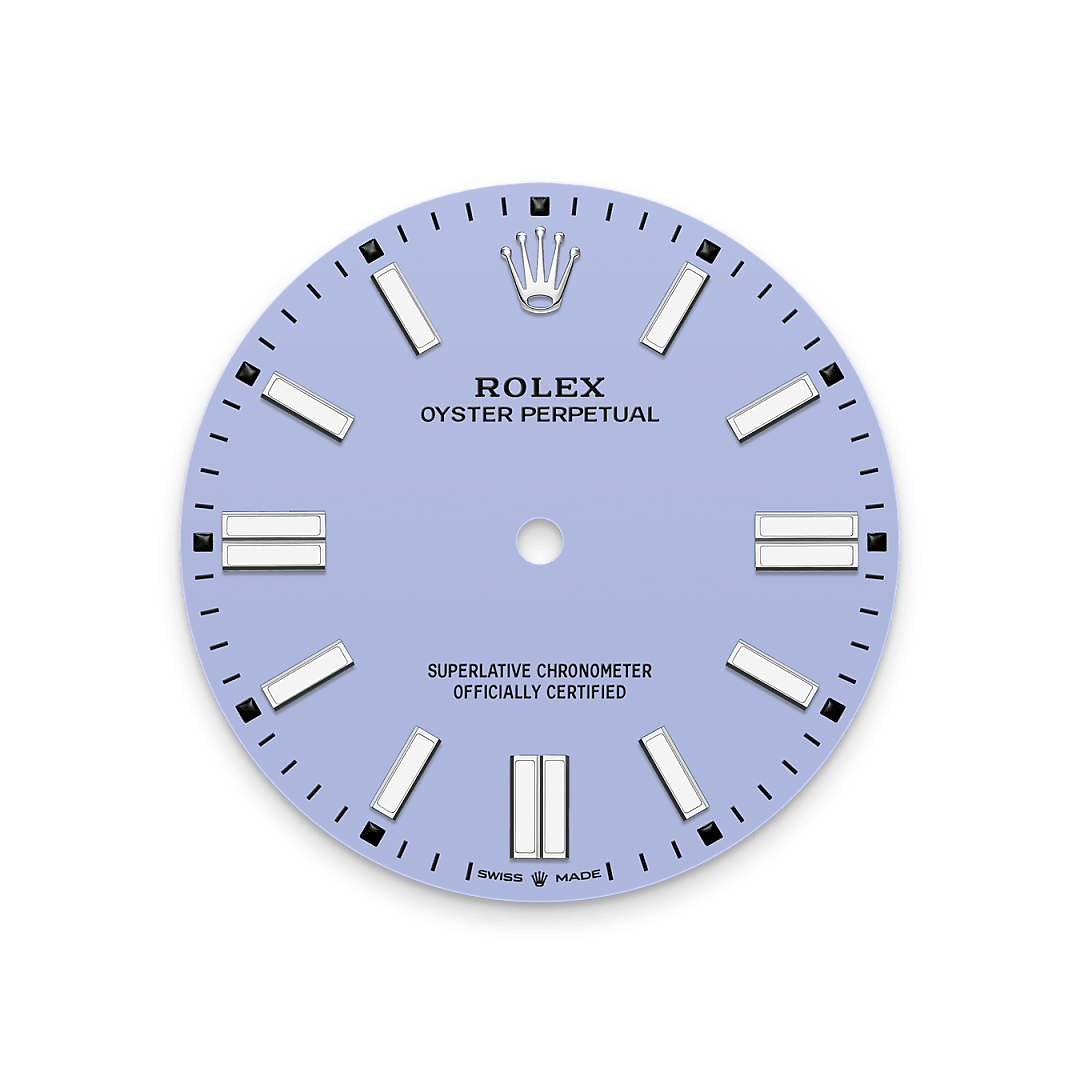 The colours created for the Oyster Perpetual range start life as a lacquer, which must be meticulously applied in a controlled-atmosphere environment to avoid dust and other contamination. The brass plate of the dial base receives layer upon layer of lacquer, six in all, to form a regular, uniform surface. The last step is varnishing and polishing to bring out the full brilliance and depth of colour. The various inscriptions are then pad printed, and the hour markers and crown riveted by hand. The dial, gleaming in its perfection, is all set to take its place on top of the movement at the watch assembly phase.