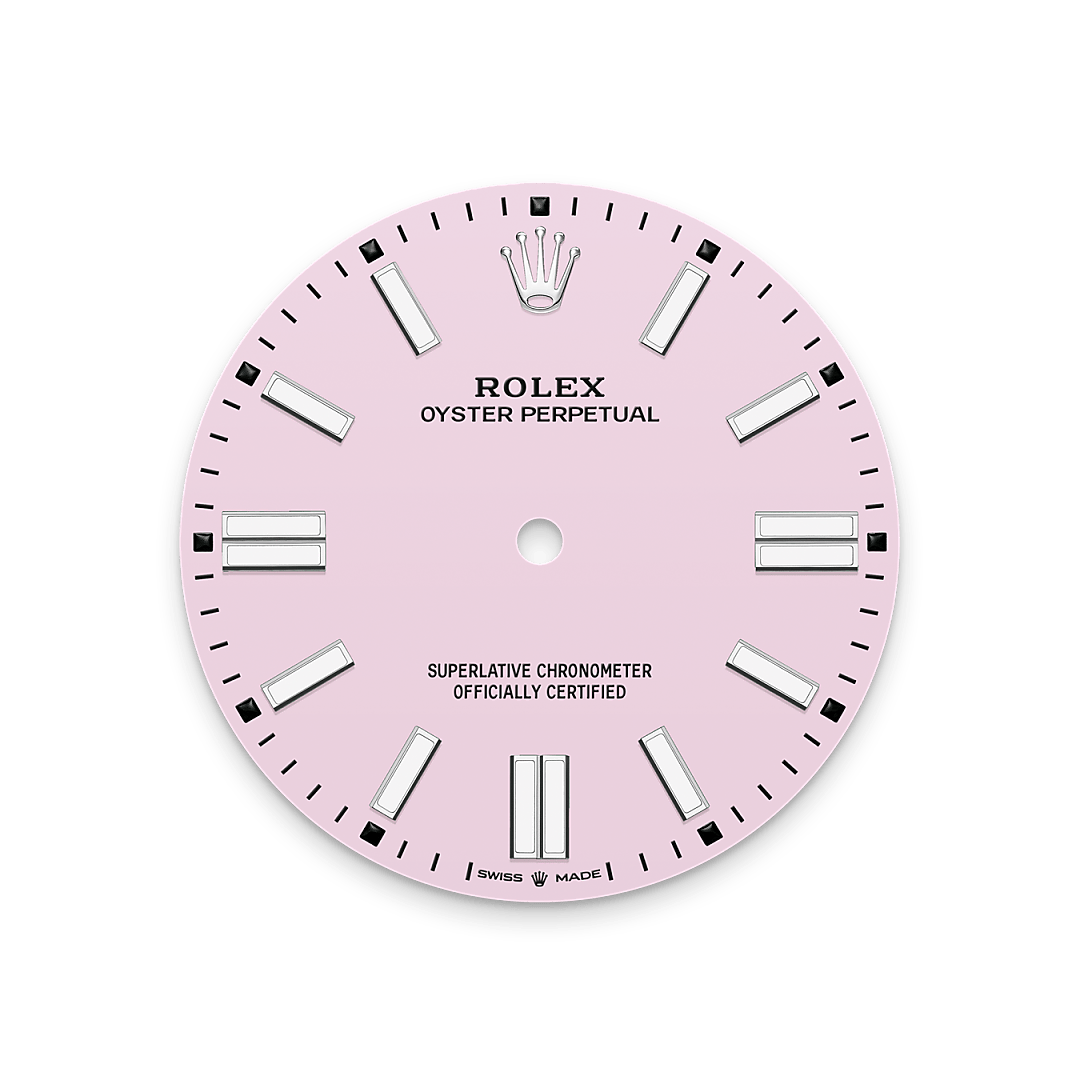 The colours created for the Oyster Perpetual range start life as a lacquer, which must be meticulously applied in a controlled-atmosphere environment to avoid dust and other contamination. The brass plate of the dial base receives layer upon layer of lacquer, six in all, to form a regular, uniform surface. The last step is varnishing and polishing to bring out the full brilliance and depth of colour. The various inscriptions are then pad printed, and the hour markers and crown riveted by hand. The dial, gleaming in its perfection, is all set to take its place on top of the movement at the watch assembly phase.