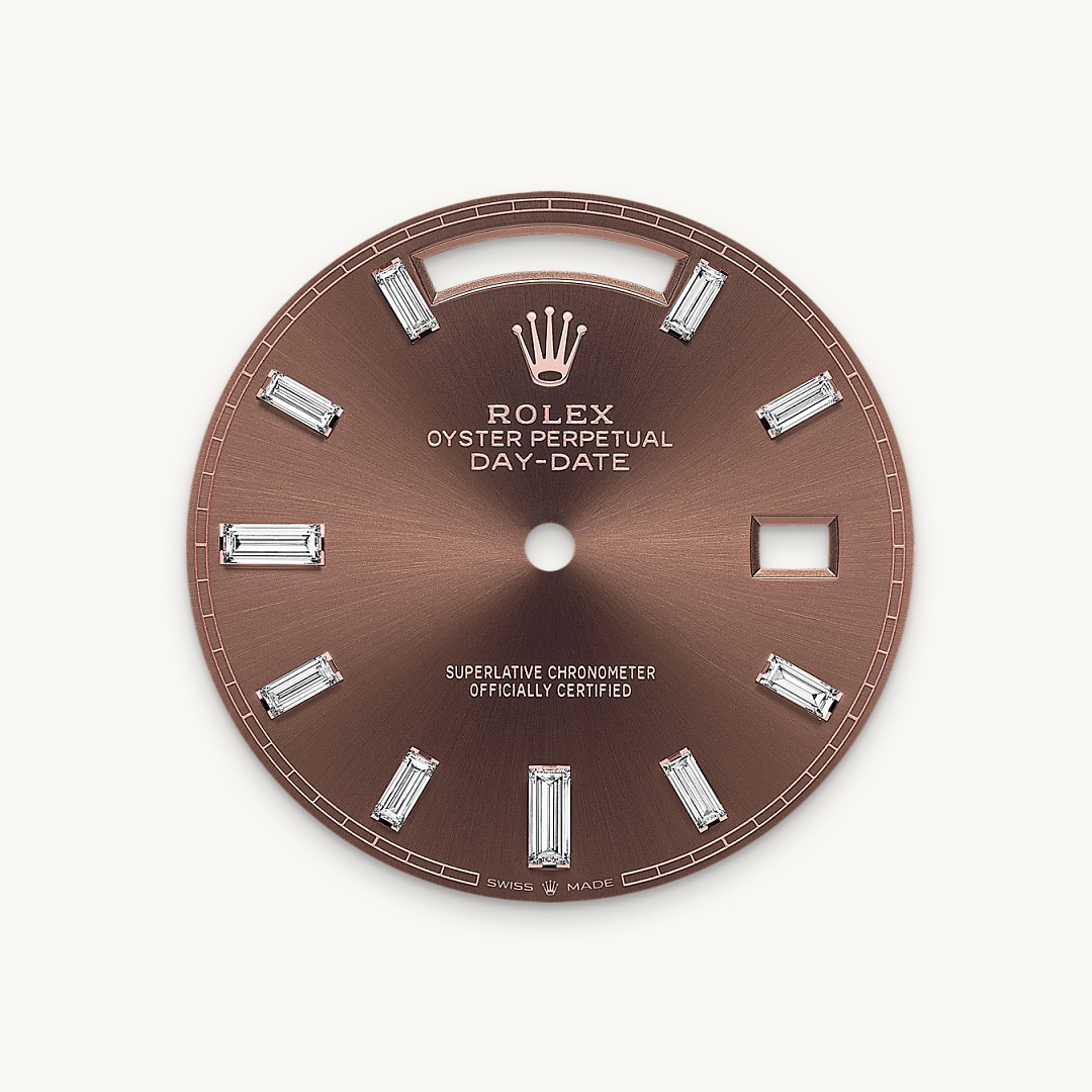This dial features 10 baguette-cut diamonds. The sunray finish creates delicate light reflections on many dials in the Oyster Perpetual collection. It is obtained using masterful brushing techniques that create grooves running outwards from the centre of the dial. Light is diffused consistently along each engraving, creating a characteristic subtle glow that moves depending on the position of the wrist. Once the sunray finish has been completed, the dial colour is applied using Physical Vapour Deposition or electroplating. A light coat of varnish gives the dial its final look.