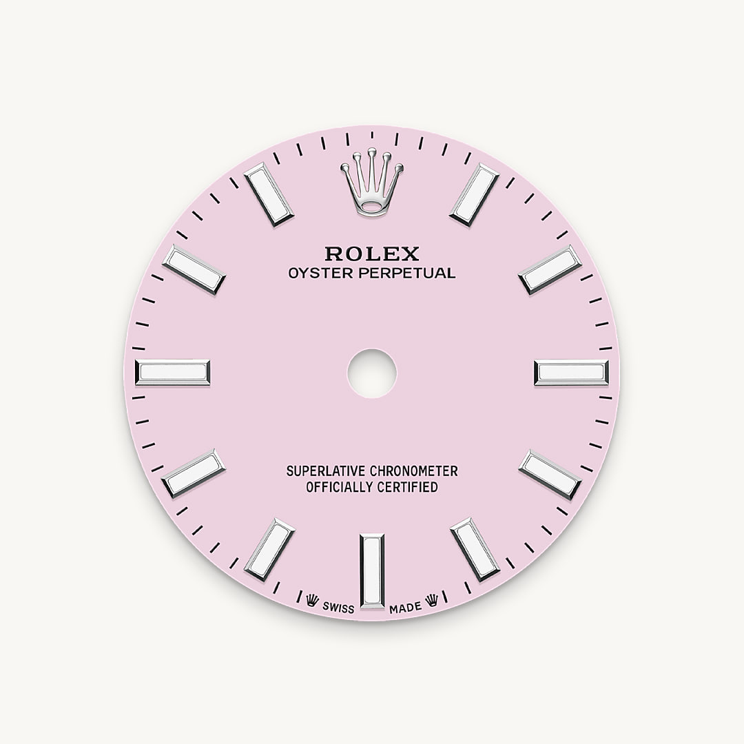 The colours created for the Oyster Perpetual range start life as a lacquer, which must be meticulously applied in a controlled-atmosphere environment to avoid dust and other contamination. The brass plate of the dial base receives layer upon layer of lacquer, six in all, to form a regular, uniform surface. The last step is varnishing and polishing to bring out the full brilliance and depth of colour. The various inscriptions are then pad printed, and the hour markers and crown riveted by hand. The dial, gleaming in its perfection, is all set to take its place on top of the movement at the watch assembly phase.
