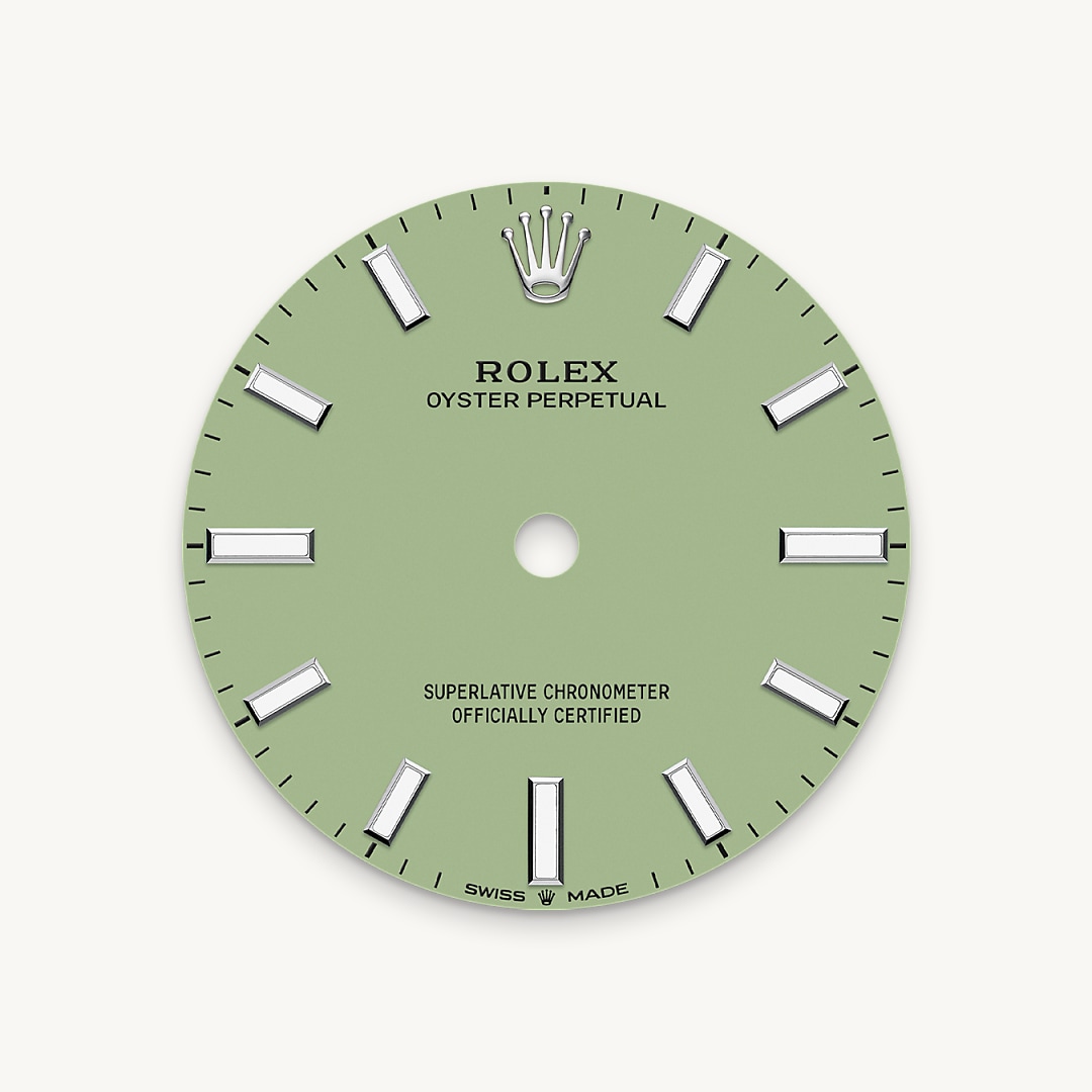 The colours created for the Oyster Perpetual range start life as a lacquer, which must be meticulously applied in a controlled-atmosphere environment to avoid dust and other contamination. The brass plate of the dial base receives layer upon layer of lacquer, six in all, to form a regular, uniform surface. The last step is varnishing and polishing to bring out the full brilliance and depth of colour. The various inscriptions are then pad printed, and the hour markers and crown riveted by hand. The dial, gleaming in its perfection, is all set to take its place on top of the movement at the watch assembly phase.