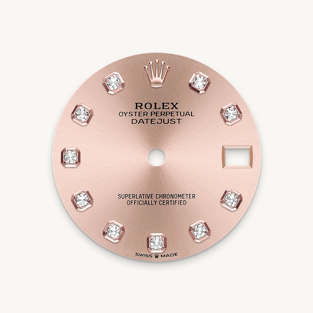 This dial features diamonds in 18 ct gold settings. The sunray finish creates delicate light reflections on many dials in the Oyster Perpetual collection. It is obtained using masterful brushing techniques that create grooves running outwards from the centre of the dial. Light is diffused consistently along each engraving, creating a characteristic subtle glow that moves depending on the position of the wrist. Once the sunray finish has been completed, the dial colour is applied using Physical Vapour Deposition or electroplating. A light coat of varnish gives the dial its final look.