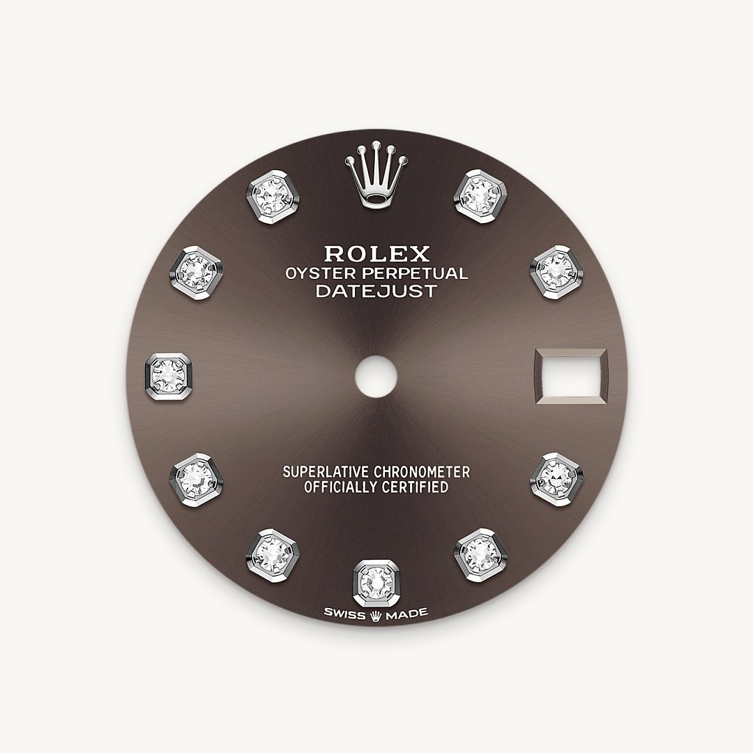 This dial features diamonds in 18 ct gold settings. The sunray finish creates delicate light reflections on many dials in the Oyster Perpetual collection. It is obtained using masterful brushing techniques that create grooves running outwards from the centre of the dial. Light is diffused consistently along each engraving, creating a characteristic subtle glow that moves depending on the position of the wrist. Once the sunray finish has been completed, the dial colour is applied using Physical Vapour Deposition or electroplating. A light coat of varnish gives the dial its final look.