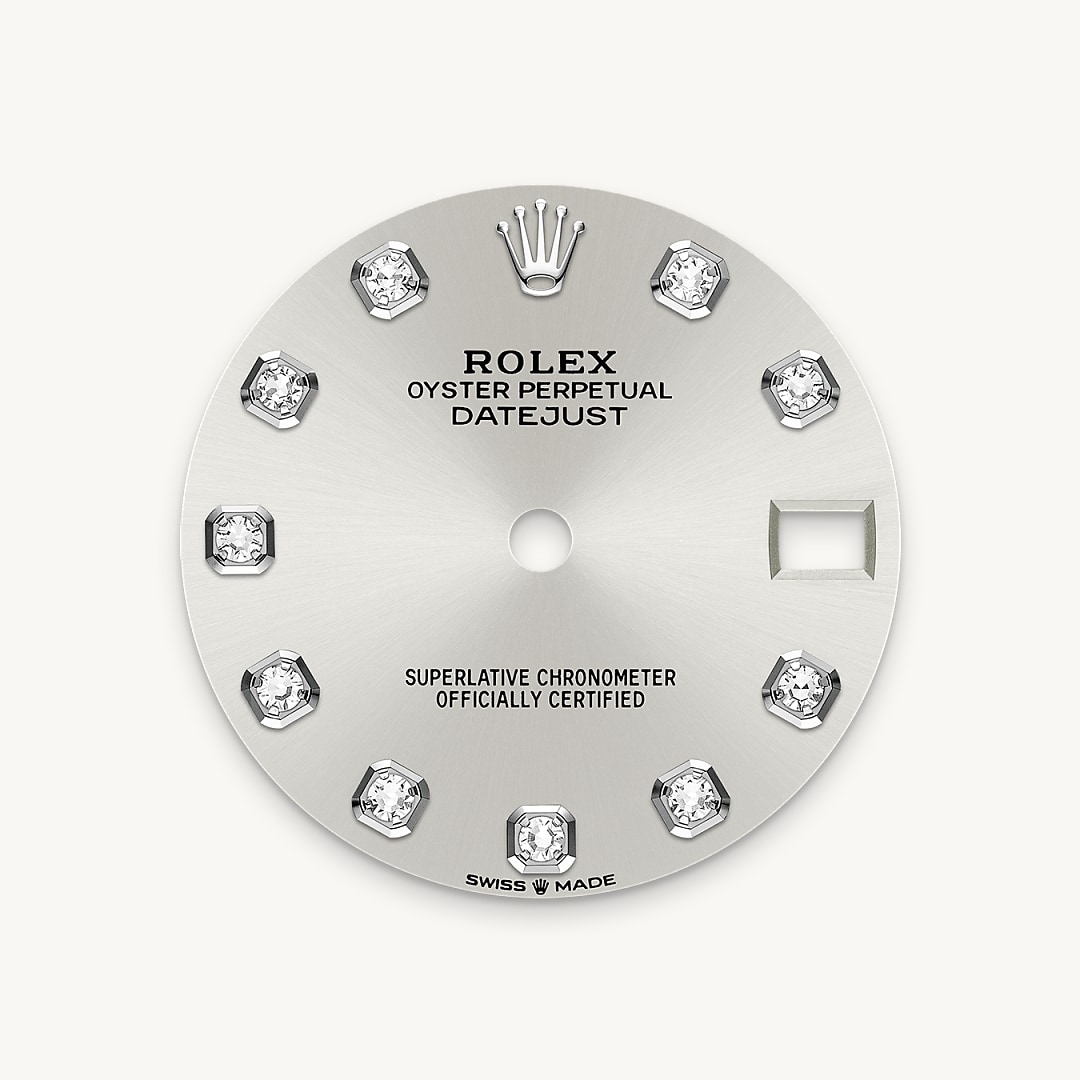 This dial features diamonds in 18 ct gold settings. The sunray finish creates delicate light reflections on many dials in the Oyster Perpetual collection. It is obtained using masterful brushing techniques that create grooves running outwards from the centre of the dial. Light is diffused consistently along each engraving, creating a characteristic subtle glow that moves depending on the position of the wrist. Once the sunray finish has been completed, the dial colour is applied using Physical Vapour Deposition or electroplating. A light coat of varnish gives the dial its final look.