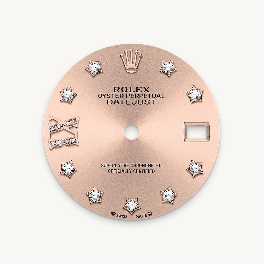 This dial features diamonds in 18 ct gold settings and a Roman IX in 18 ct gold, set with 8 diamonds. The sunray finish creates delicate light reflections on many dials in the Oyster Perpetual collection. It is obtained using masterful brushing techniques that create grooves running outwards from the centre of the dial. Light is diffused consistently along each engraving, creating a characteristic subtle glow that moves depending on the position of the wrist. Once the sunray finish has been completed, the dial colour is applied using Physical Vapour Deposition or electroplating. A light coat of varnish gives the dial its final look.