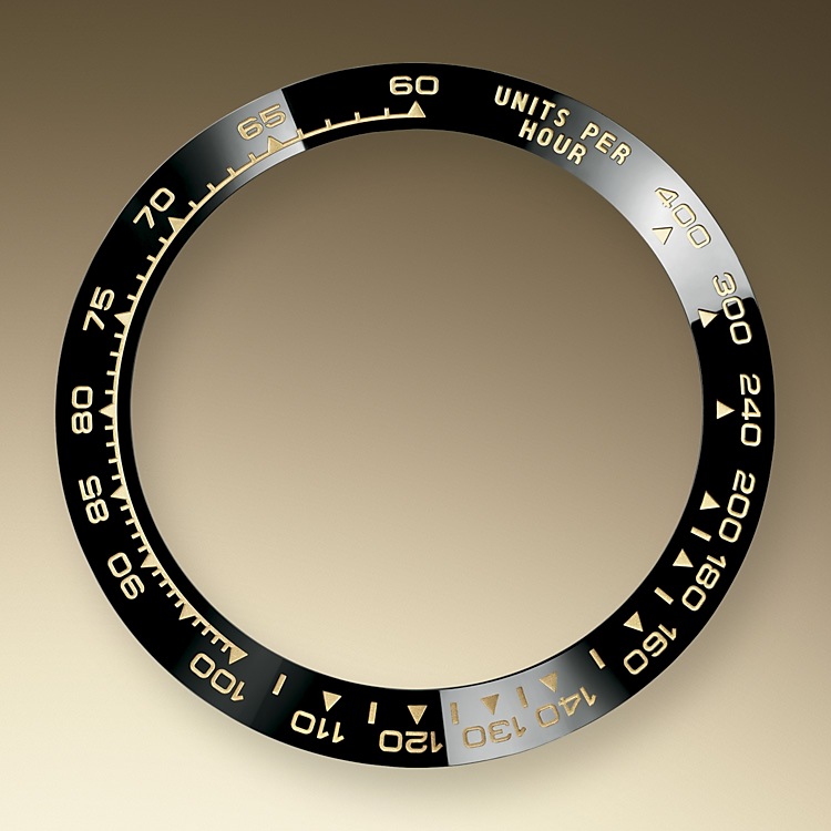 A key part of the model's identity is the bezel moulded with a tachymetric scale for measuring average speeds of up to 400 miles or kilometres per hour. Blending of high technology with sleek aesthetics, the black bezel is reminiscent of the 1965 model that was fitted with a black Plexiglas bezel insert.<br>The monobloc Cerachrom bezel in high-tech ceramic offers a number of advantages: it is corrosion resistant, virtually scratchproof and the colour is unaffected by UV rays. This extremely durable bezel also offers an exceptionally legible tachymetric scale, thanks to the deposition of a thin layer of platinum in the numerals and graduation via a PVD (Physical Vapour Deposition) process. The monobloc Cerachrom bezel is made in a single piece and holds the crystal firmly in place on the middle case, ensuring waterproofness. 