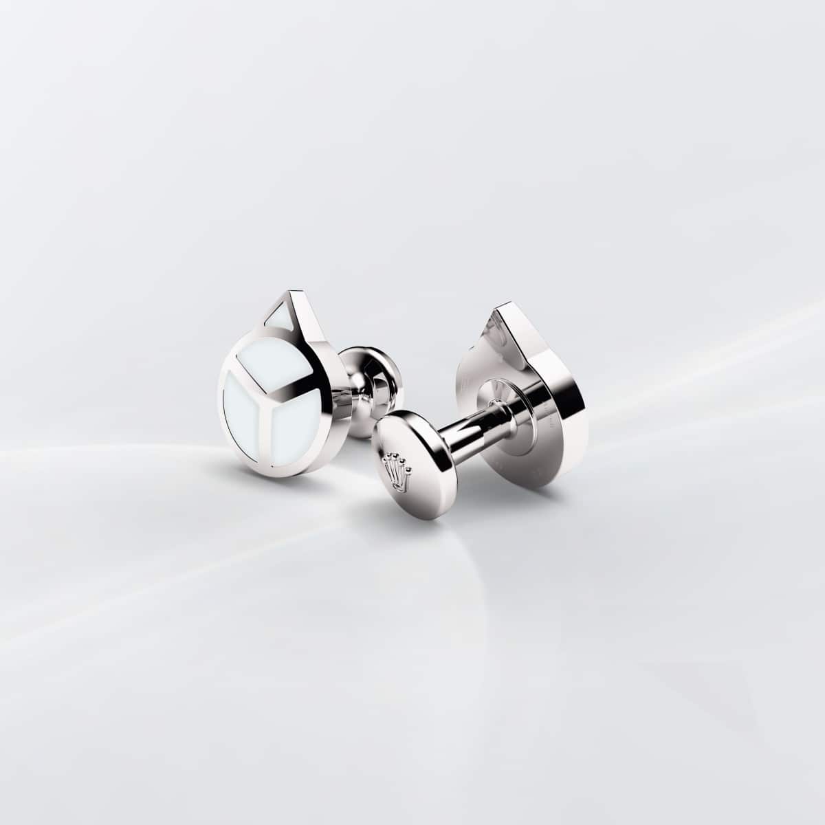 Rolex cufflinks made of 18 ct white gold that echo the hour hand found on Professional Rolex watches, equipped with a Chromalight display.